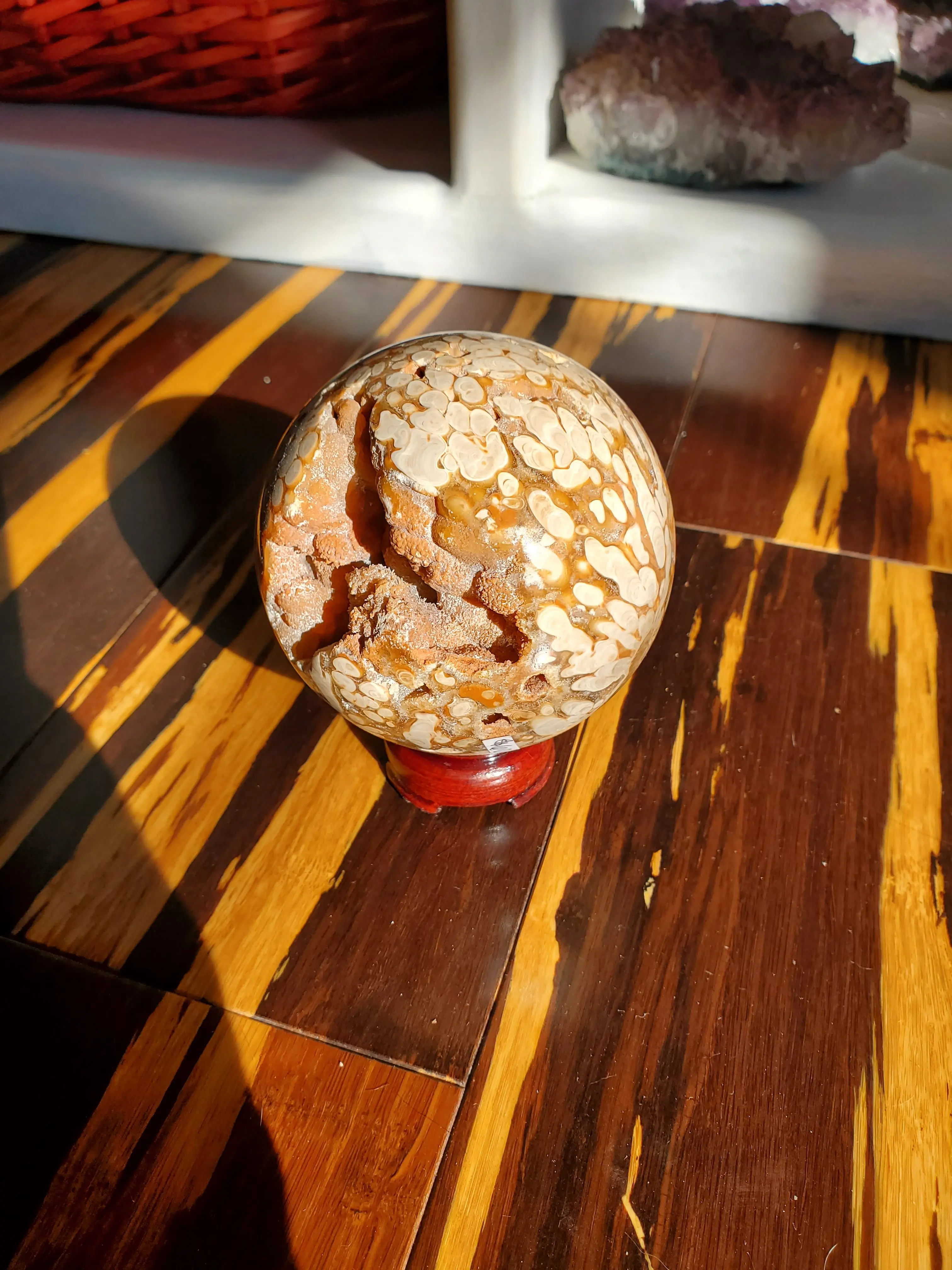 Natural polished Amber Calcite sphere with druzy