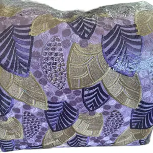 Lace Fabric - Purple and gold Lace Patterned Cover, Versatile Design for Various Use Cases.