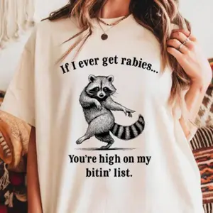 Funny Raccoon Rabies Graphic Tee | Vintage Humor Shirt | Short Sleeve Crewneck Unisex Top | Gift for Men & Women