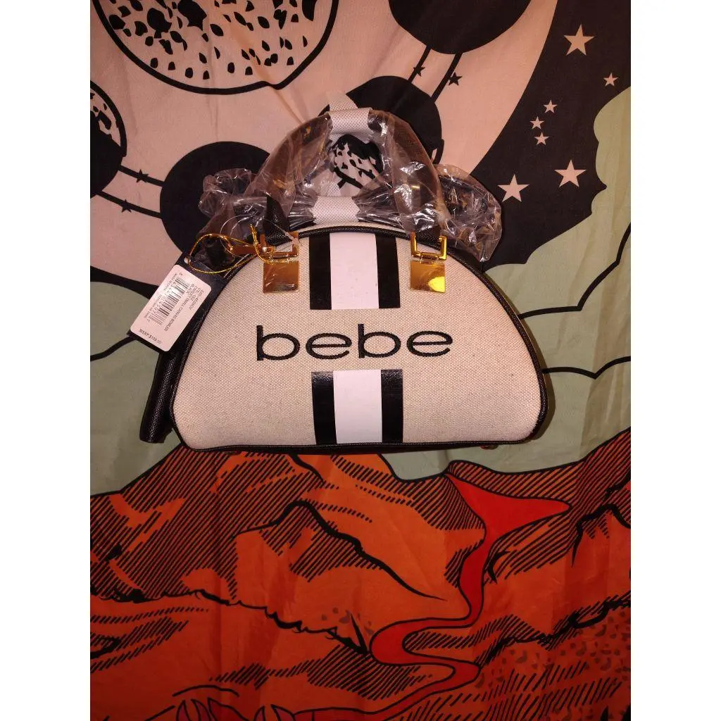 Bebe Handbag - White with Black Stripes, Gold Hardware, and Bebe Logo