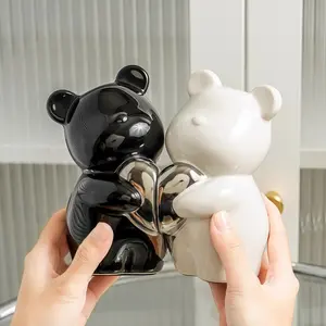This black-and-white heart-holding bear figurine represents a perfect fusion of romance and art. Crafted from ceramic, this minimalist European-style ornament is an ideal decorative accent for the bedroom, living room, or desk—and also serves as a