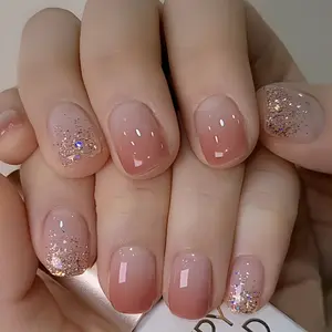 Set of 24 Shiny Short Squoval Press-On Nails in a Gradient Pink, Featuring Glitter; Reusable Fake Nails for Women.