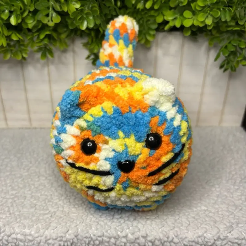 Handmade Crochet Chonky Kitten in the color Beachball