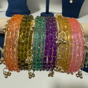 Beautiful set of bangles. Has 18 different color Raindrop glass bangles with 4 Kashmiri bangles with Ghunghru.