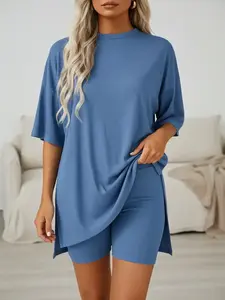 Multiple color options; loose casual women’s set made from modal fabric that is skin-friendly and highly elastic; knit two-piece set featuring a crew neck, drop shoulders, mid-length sleeves, and side slits; T-shirt and high-waisted fitted shorts set; sol