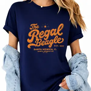 The Regal Beagle Vintage Oversized T-Shirt - Casual Black Cotton Tee with Rolled Sleeves and Orange Text, EST. 1977, Santa Monica Ca. - Perfect for Summer Style, Acid Wash Baggy Tee for Men and Women