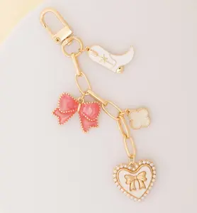 Western Theme Bag Charm Keychain with Miniature Boot Bow Clove Heart Gold-Tone Accents 4.5" Height 2" Width Secure Keyring Lobster Clasp