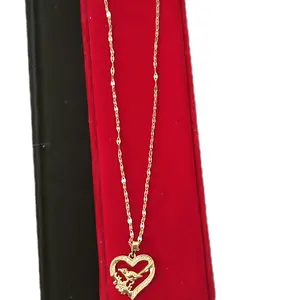 Beautiful and delicate necklace with a heart pendant featuring a little bird inside, made of stainless steel.