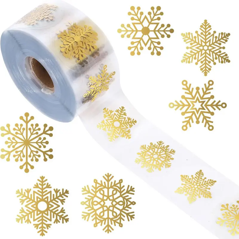 500 sheets of golden snowflake stickers in a roll, made of transparent PVC with self-adhesive backing. Ideal for Christmas, home decoration, window decoration, notebooks, phone cases, water bottles.