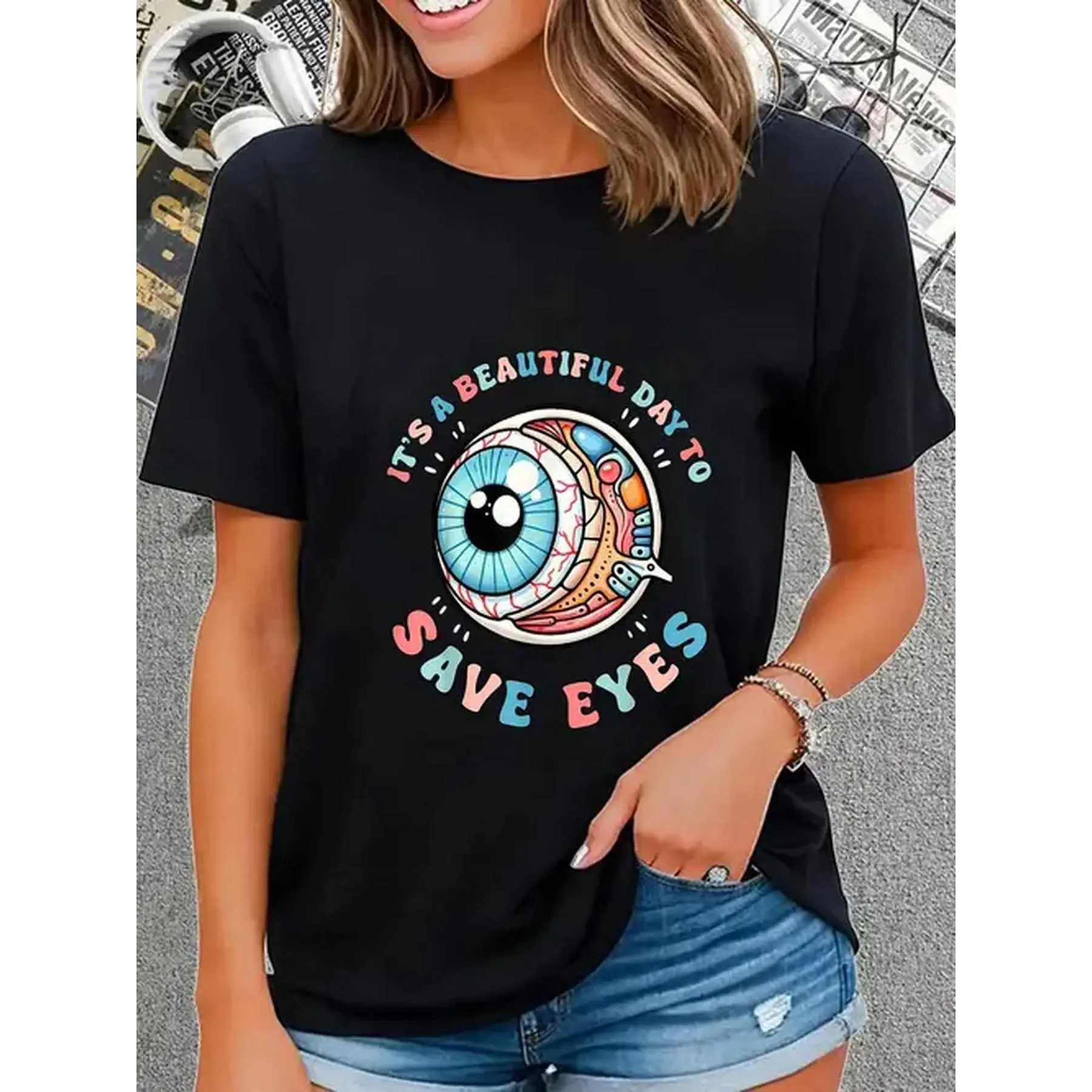 100% Eye Safe Optometry T-Shirt: Funny World Optometry Day design with colorful eye and trendy glasses illustrations, casual short-sleeved crew neck, humorous message for opticians and eye care professionals.