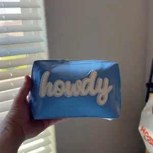 "Howdy" Makeup Bag - Blue with "howdy" Text Design