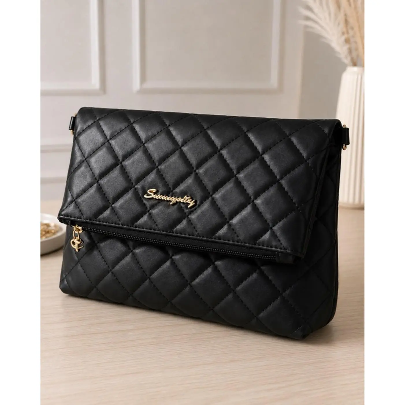 SavvyStyle Black Quilted Clutch Bag with Gold Logo and Zip Closure for Women's Elegance