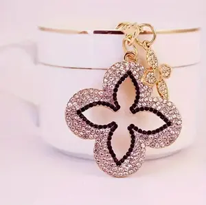 Sparkling Rhinestone Four-Leaf Clover Keychain – Colorful Hollow Alloy Design with Golden-Tone Finish, Perfect for Bags & Accessories, Ideal Birthday Gift for Her