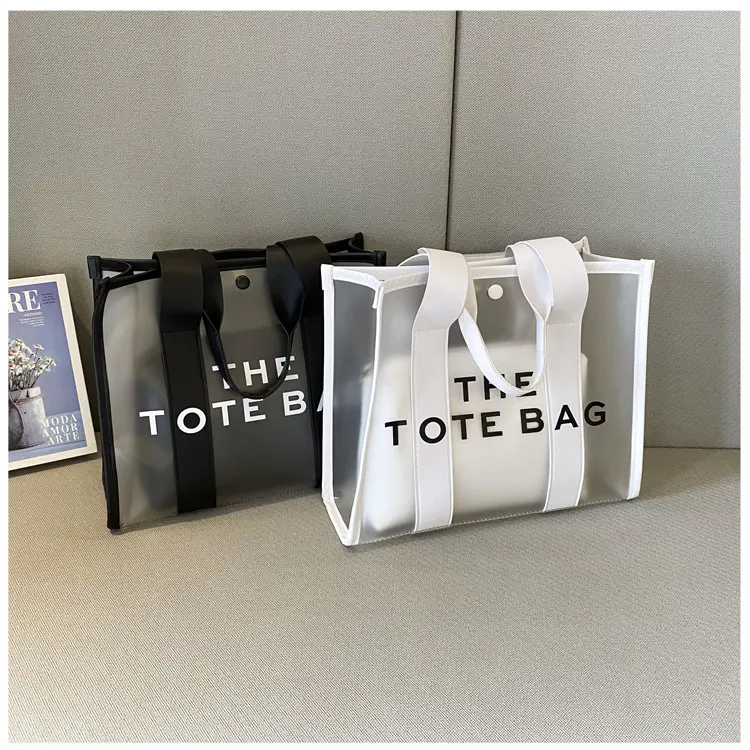 Clear PVC Tote Bag with "THE TOTE BAG" Letter Print, Large Capacity Transparent Top Handle Handbag, Waterproof Shoulder Purse for Beach, Shopping & Daily Outings