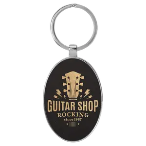 Leatherette /Metal Black/Gold Oval Keychain