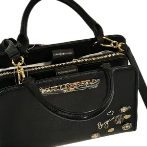 Karl Lagerfeld Paris Black Crossbody Bag with Gold Hardware and Heart Embellishments