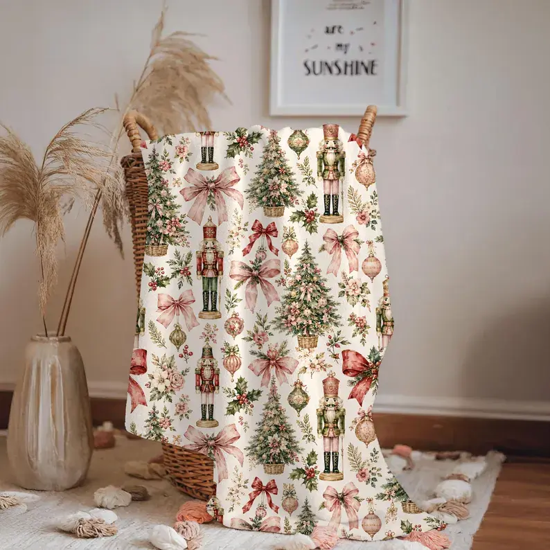 Coquette Nutcracker Christmas throw blanket, soft pink ballerina fleece blanket with bow detail, pastel girly Christmas decor, cozy plush holiday throw for couch and bedroom, cute ballet lover Christmas gift for teen girls, sweet pink vintage Nutcracker a
