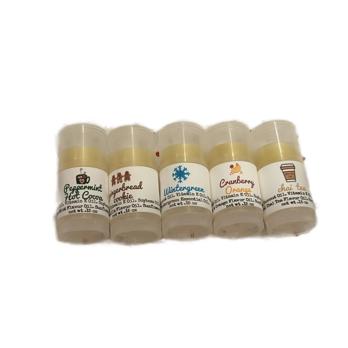 Holiday Mini Lip Balm Set in gift bag- Peppermint Hot Cocoa, Cranberry Orange, Gingerbread Cookie, Wintergreen, Chai Tea. All Natural, Small Batch, Beeswax Lip Balms. Moisturizing Nourishing Skincare with smooth application.