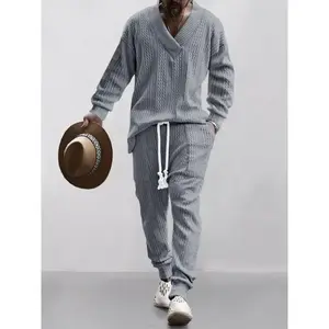 Men’s two-piece set featuring a solid jacquard pattern: drop-shoulder V-neck top and drawstring-waist pants. Suitable for autumn and winter.