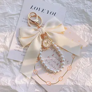 Pearl Bow Keychain with Elegant Pearl Chain & Large White Bow Charm for Purse Backpack Car Keys Phone Cases Gift for Women