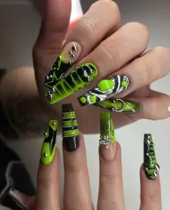 A bold and edgy set of nails featuring neon green, black, and metallic silver designs with unique 3D embellishments, creating a futuristic and standout look.