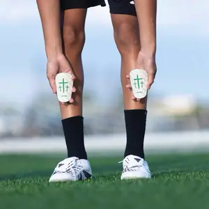 Momentum White/Black Cross Shin Mini Guards - Size 4x3in for Enhanced Performance and Safety on the Field