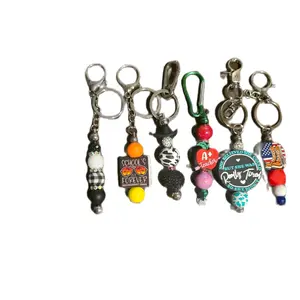 Metal bar keychains made with silicone focals and wide variety of beads. Various designs to choose from.