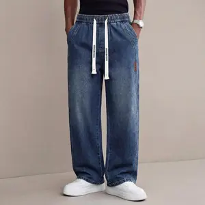Men's casual street-style loose denim jeans, elastic waistband, straight-leg long pants, paired with a white drawstring