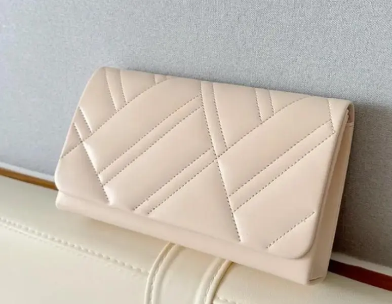 Cream Clutch Handbag with Quilted Design and Elegant Closure for Stylish Occasions