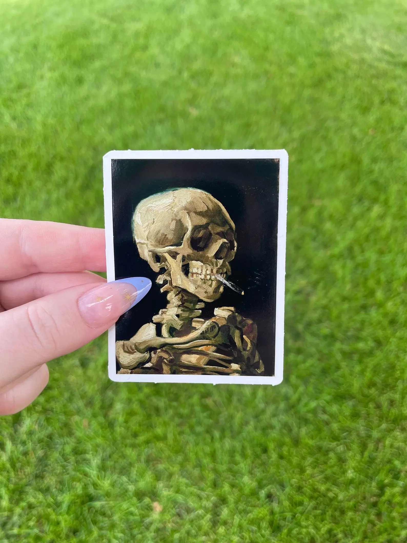 Skeleton with a Lit Cigarette Sticker, Vinyl Sticker, Fine Art by famous artist