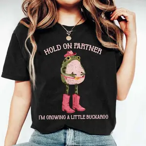 Graphic T-shirt Hold On Partner I'm Growing A Little Buckaroo Shirt, Cowboy Pregnancy Reveal Tee, Funny Frog Graphic Shirt, Cowgirl Baby Announcement Top, Western Maternity Outfit, Unisex Cotton, TikTok Trending