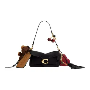COACH Tabby 26 Leather Crossbody Bag with Multifunctional Pocket and Logo Charm for Women in Brass and Black