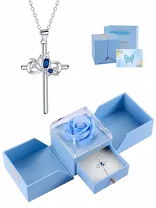 Blue Diamond Cross Bloom Luxury sapphire necklace with butterfly and cross design. Paired with a surprise double-door preserved rose jewelry box, ideal for birthdays, Mother's Day and Valentine's Day. Cross Necklaces