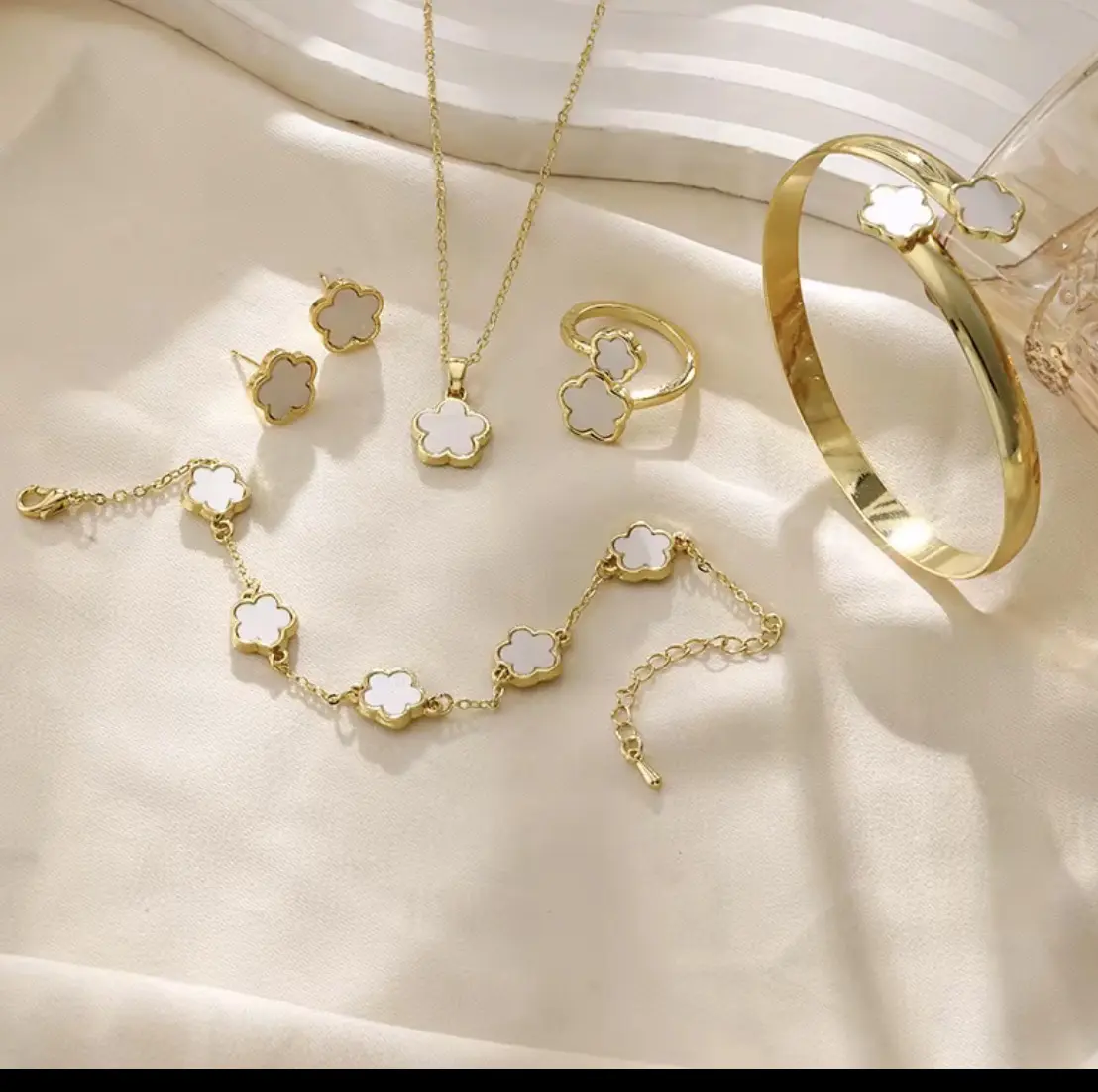 5 piece clover set, including bracelet, earrings, necklace and ring