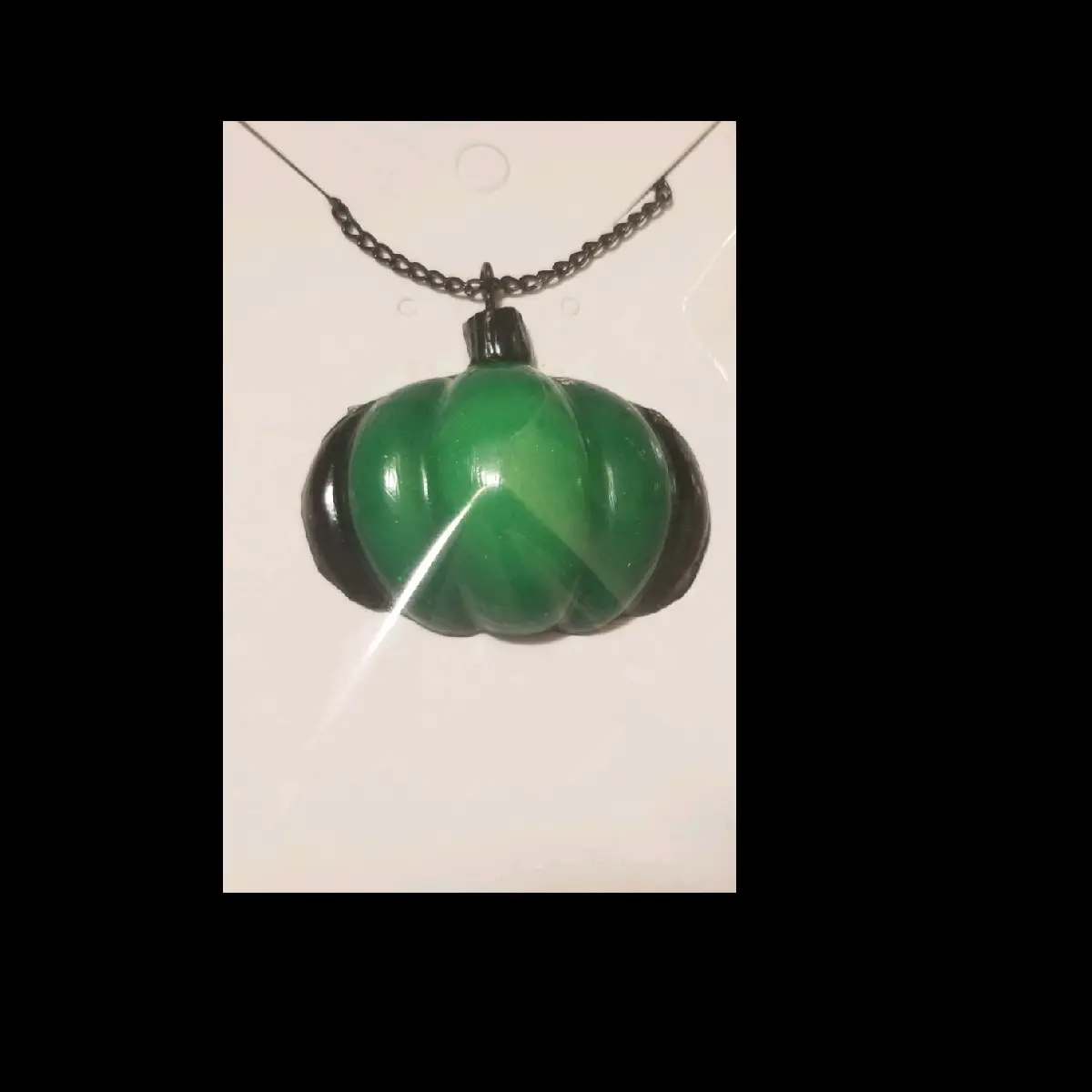 Green and black Glow in the dark pumpkin pendant necklace