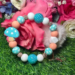 Peach mushroom wristlet keychain color scheme peach, white, blue polka dot print and bling beads made with  wire
