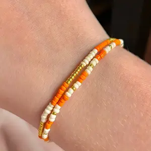Two pack of orange seed beed bracelets
