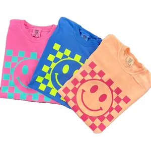 Neon Retro Smiley Face with Checkerboard Background T-Shirt in Pink Blue and Orange Colors Womenswear Tshirt