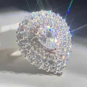 This teardrop-shaped pink flower ring is crafted with sparkling cubic zirconia, featuring delicate 3D petal designs that exude a romantic bohemian vibe. Perfect for bridal engagements, weddings, parties, banquets, and cocktail events, it adds a brilliant