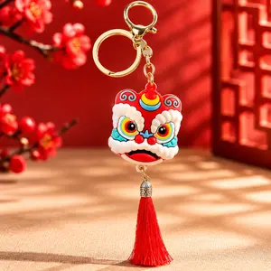 Creative plush lion‑dance car ornament keychain, New Year‑style lucky lion cartoon pendant decoration, mascot keyring charm, festive gift and car interior accessory, adorable plush bag décor.