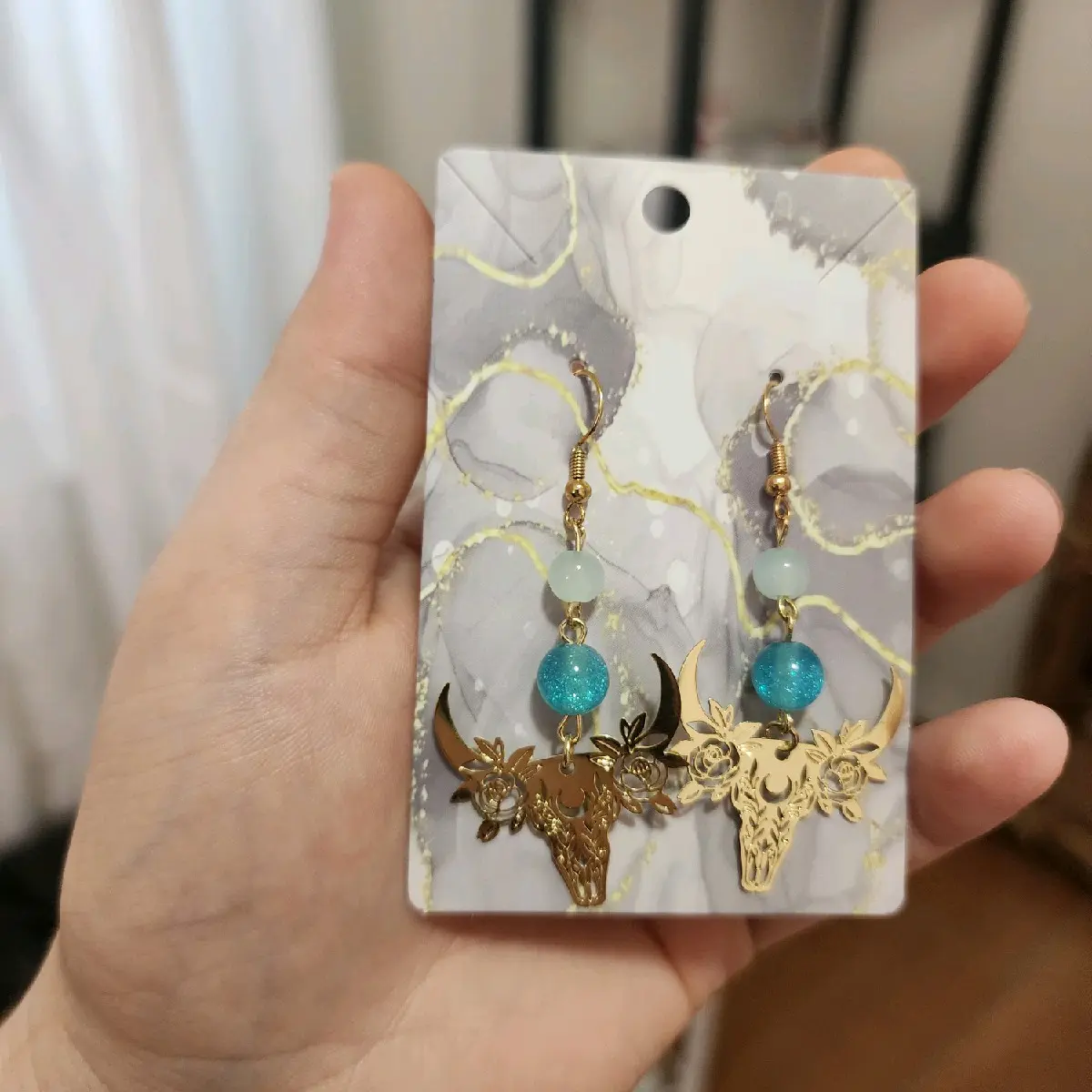 teal girl hook earrings