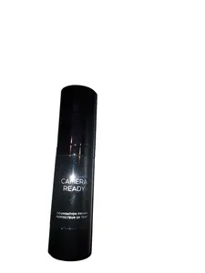A sleek black spray bottle labeled 'Camera Ready' tinted. Gives a Matte finish. Apply before foundation on clean skin. For Brown skin tone.