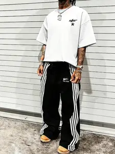 This men's two-piece outfit includes a printed short-sleeved T-shirt and printed trousers with lettering and star patterns. Made of knit fabric, it's suitable for everyday wear and can be worn year-round. Matching Casual Outfit Set