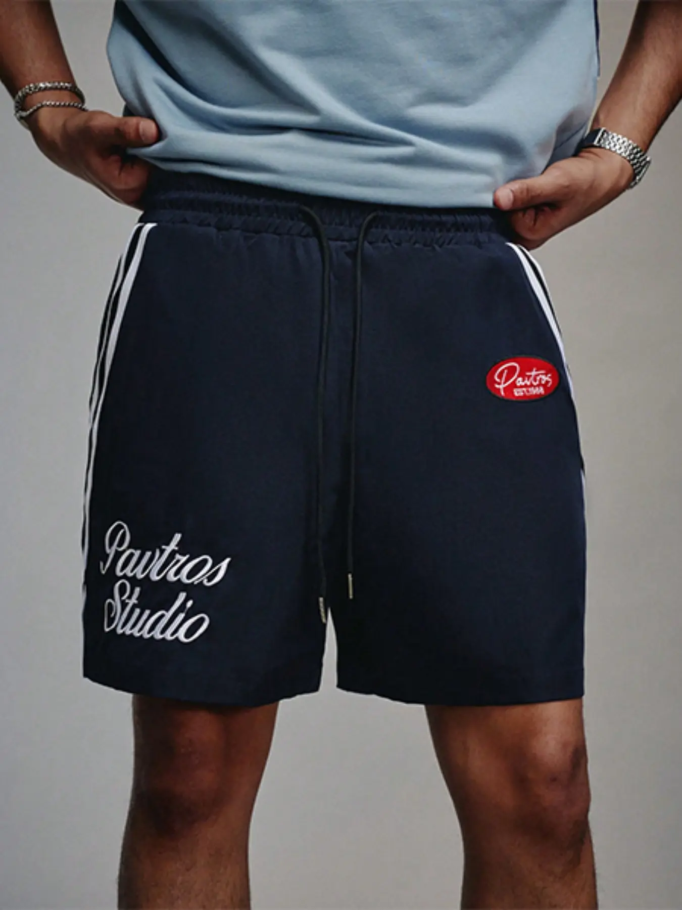 Trendy Men's Navy "Pavtros Studio" Side Stripe Shorts, Elastic Drawstring Waist Casual Bottoms with Embroidered Logo, Retro Sporty Streetwear Shorts for Street Style & All-Day Daily Wear #MensStreetwearShorts #StudioAestheticFashion #VersatileSummerShorts
