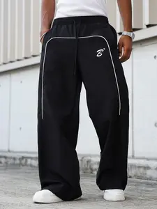 Men’s street-style cargo pants with side stripes, pockets, and a drawstring waist; solid-color casual athletic pants made from durable, breathable fabric—suitable for commuting and travel/sports; versatile summer cargo pants.
