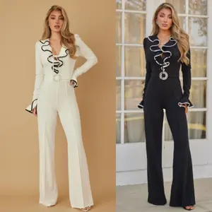 FUN RUFFLE STRING JUMPSUIT - RUFFLE PATTERN LONG SLEEVES - CRYSTAL OVAL STONE PIN BUCKLE DETAIL ON WAIST - RUFFLE ON CUFF AND CHEST AREA - ZIPPER ON THE BACK