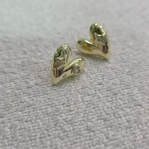 Heart-Shaped Earrings with Embedded Diamonds - Stylish and Elegant Jewelry Piece