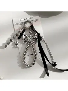 Unique bag pendant decoration keychain accessory, original new design, handmade beaded bow pendant in black tones, Bag Charms