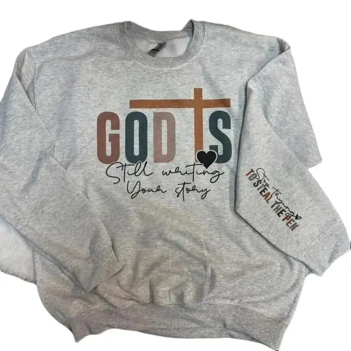 God Is Still Writing Your Story Sweatshirt on Ash Gray