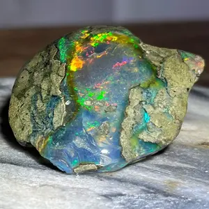 Natural Ethiopian water Opal Specimen cabbed with clear base and rainbow play of color or “fire”